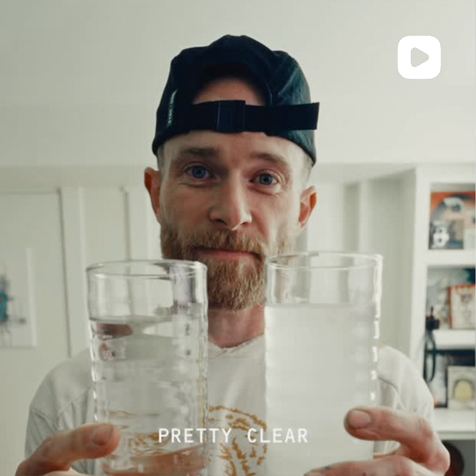 Kaged Instagram post thumbnail of a man holding two clear glasses of water in a bright kitchen, overlaid text PRETTY CLEAR